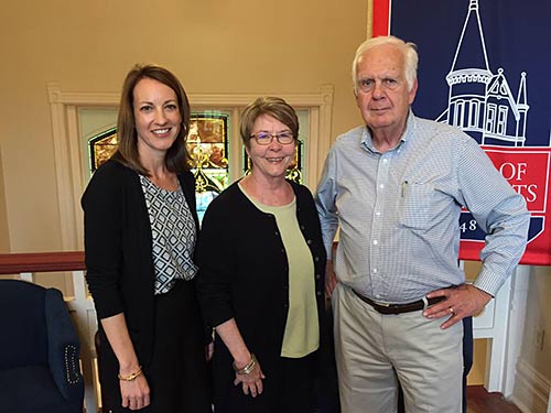 Susan Nicholas (left), North Mississippi VISTA Project assistant director at UM, welcomes new volunteers Allen and Susan Spore.